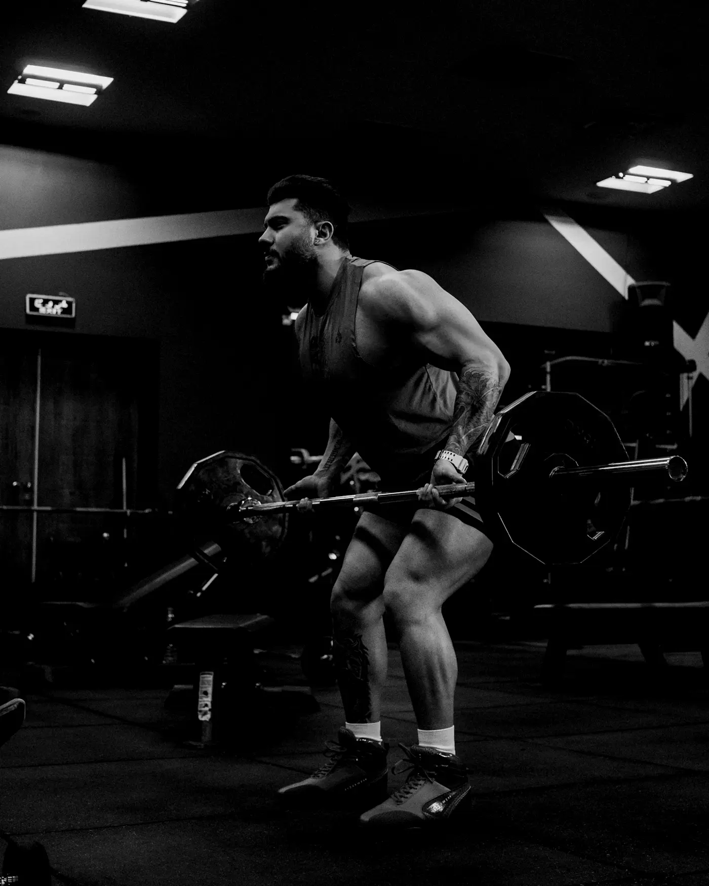 A lifter mid-deadlift with a loaded barbell